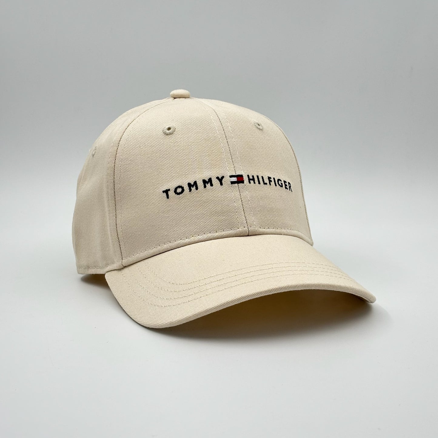 TOMMY HIFILGER CREAM LETTER LOGO