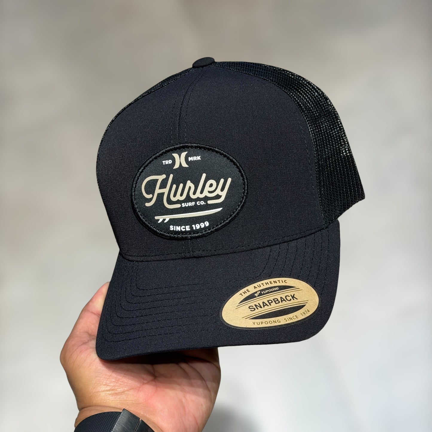 Hurley black cursive font